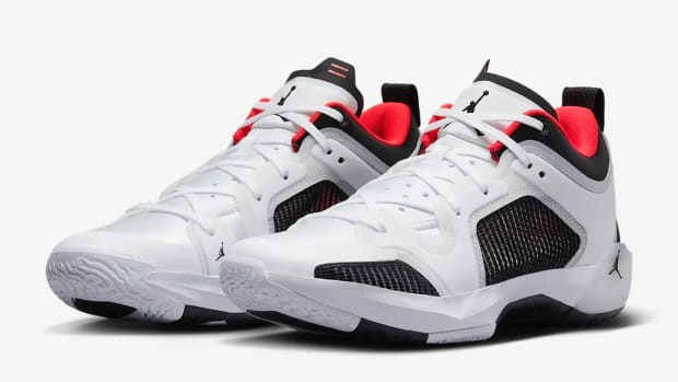 View of white, lack, and red Air Jordan shoes.